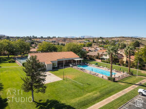 Swimming pool featuring a lawn