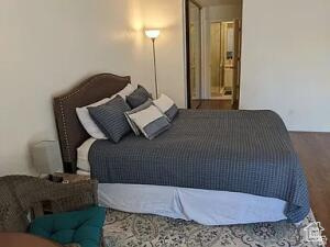 Bedroom with wood finished floors