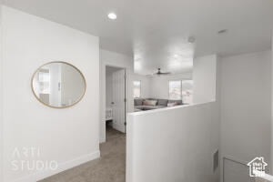 Hallway featuring recessed lighting and carpet