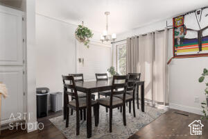 Dining room featuring a chandelier and dark wood finished floors