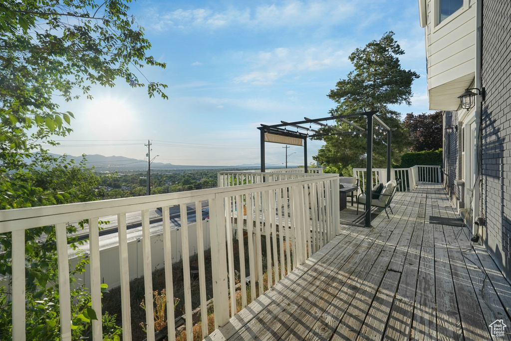 Wooden terrace featuring a pergola