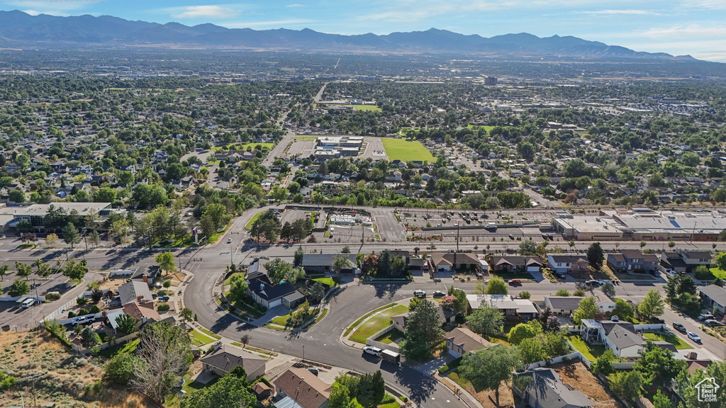 Aerial view of property\'s location with a mountainous background