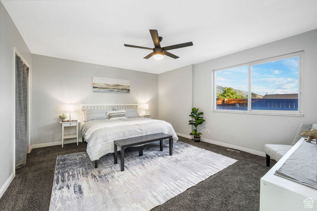 Bedroom featuring carpet floors and ceiling fan