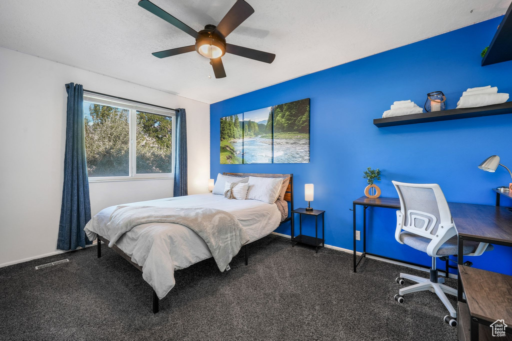 Bedroom with carpet floors and a ceiling fan