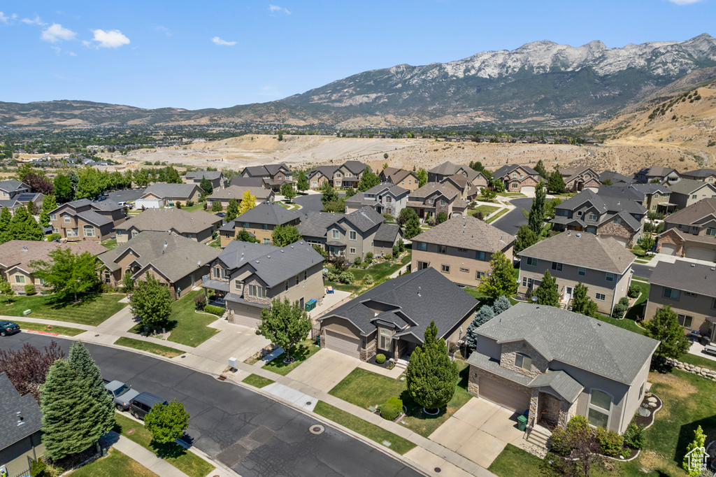 Aerial overview of property\'s location featuring a mountainous background and nearby suburban area