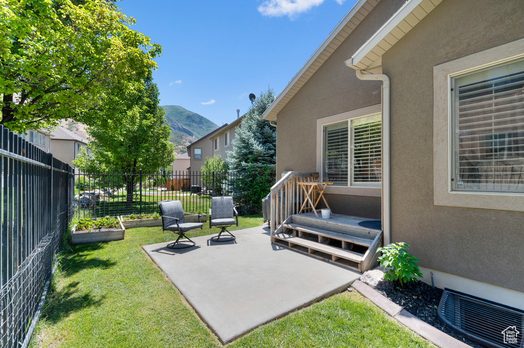 View of patio / terrace with a mountain view
