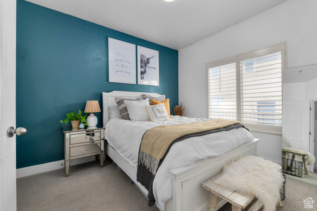 Carpeted bedroom with baseboards