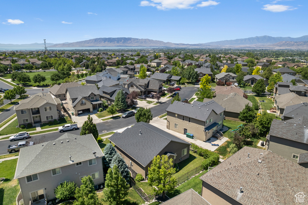 Aerial perspective of suburban area featuring a mountain backdrop