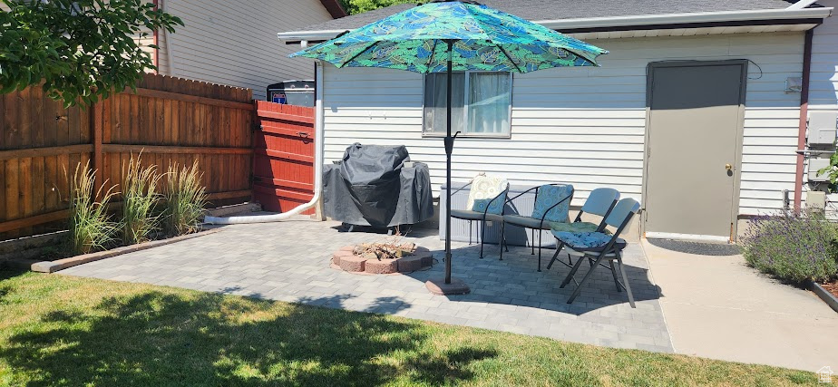 View of patio / terrace with grilling area and an outdoor fire pit