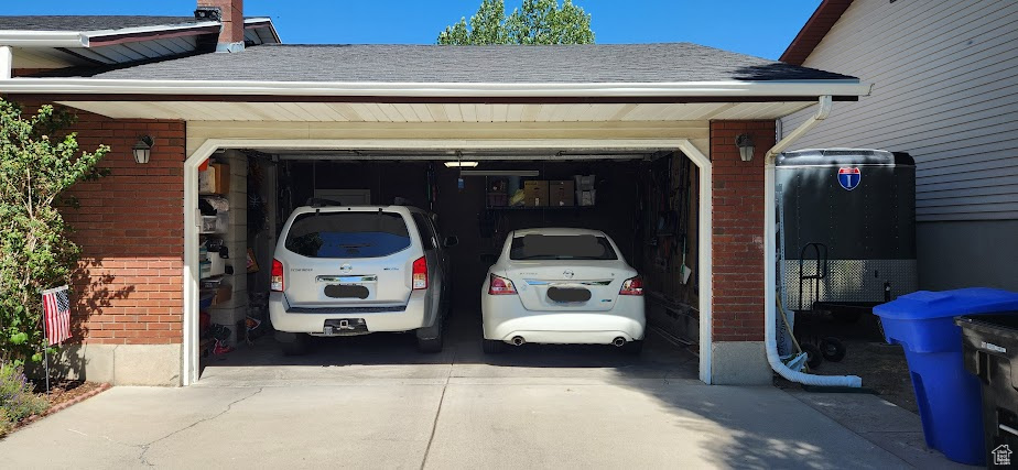 Garage featuring driveway