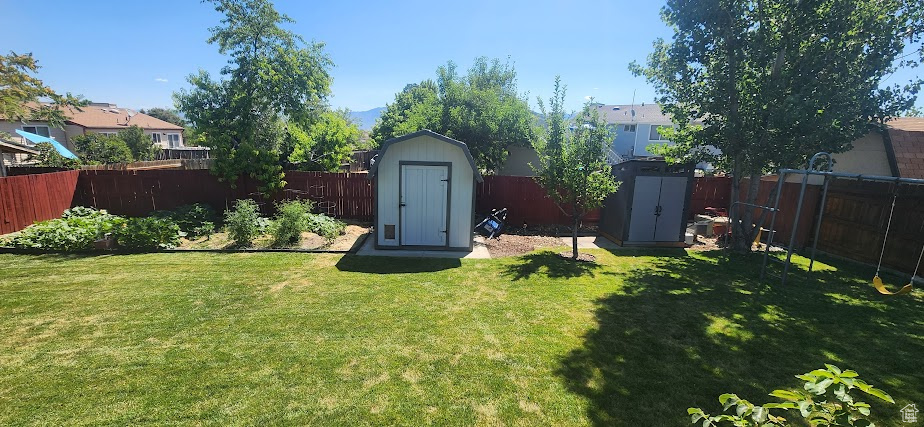Fenced backyard with a shed