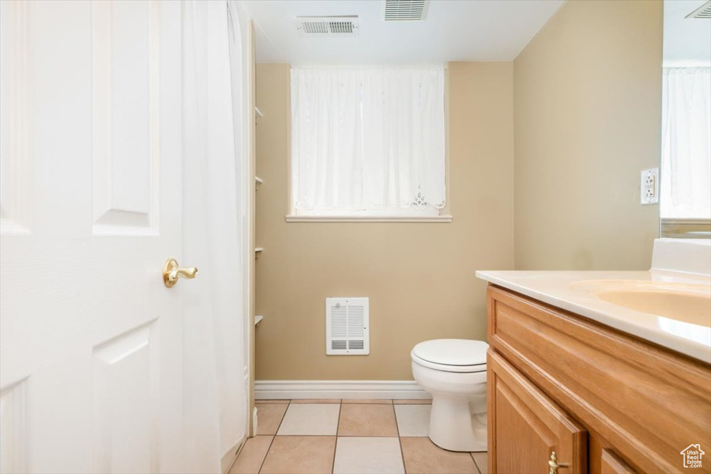Bathroom with vanity and tile patterned flooring