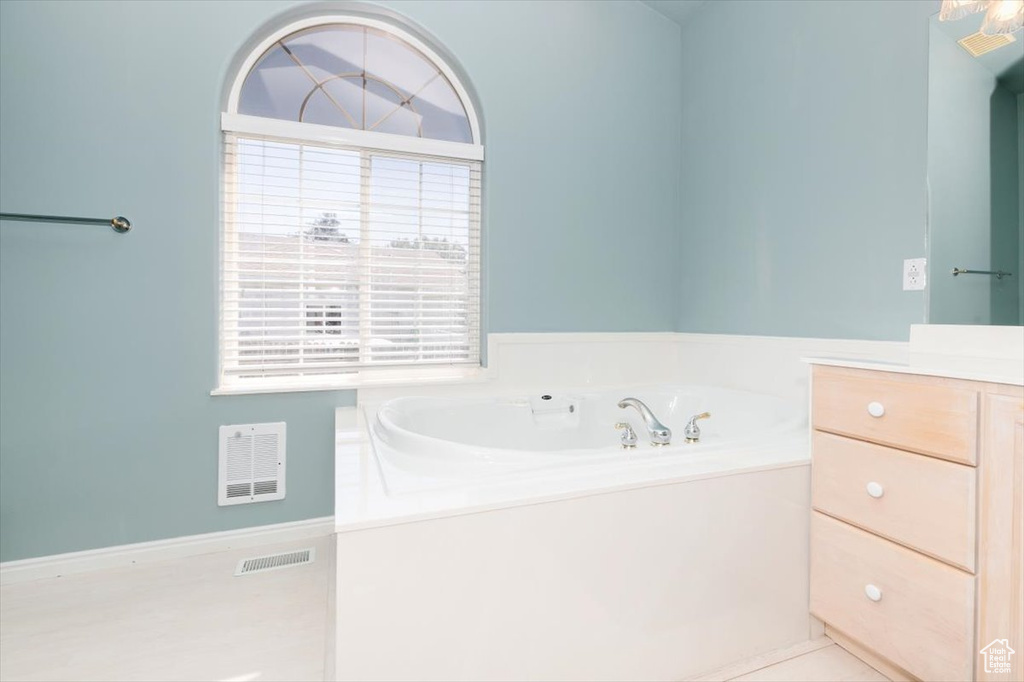 Bathroom with a garden tub and vanity