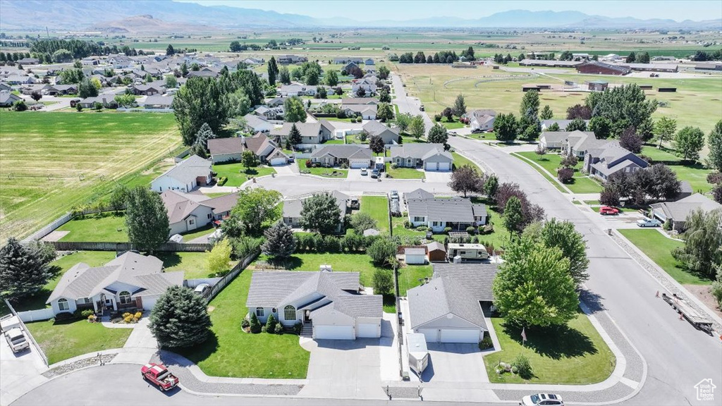 Aerial view of residential area with a mountainous background
