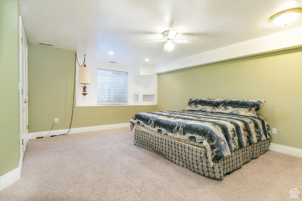 Bedroom featuring carpet and ceiling fan