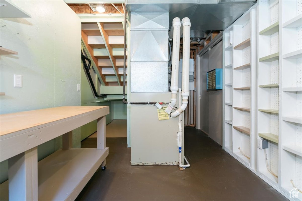 Unfinished basement with heating unit