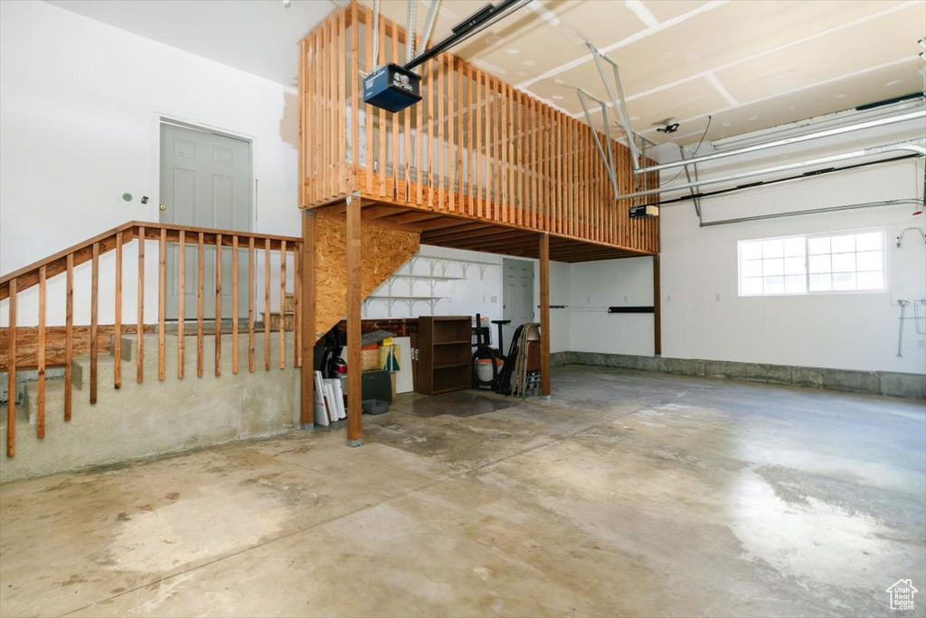 Garage featuring a garage door opener