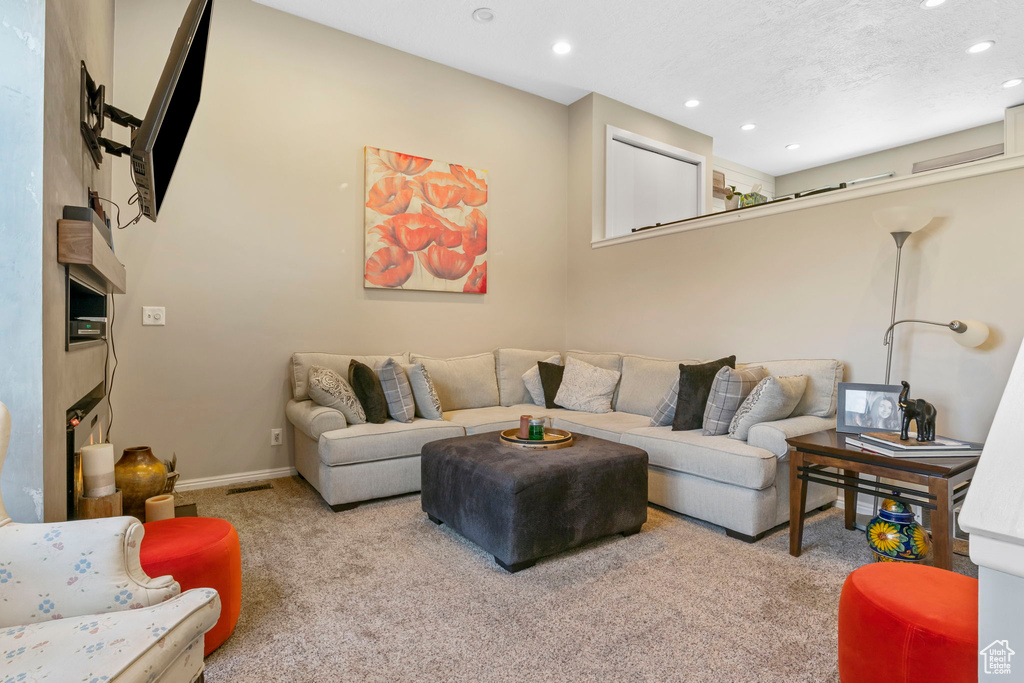 Living room with carpet floors and recessed lighting