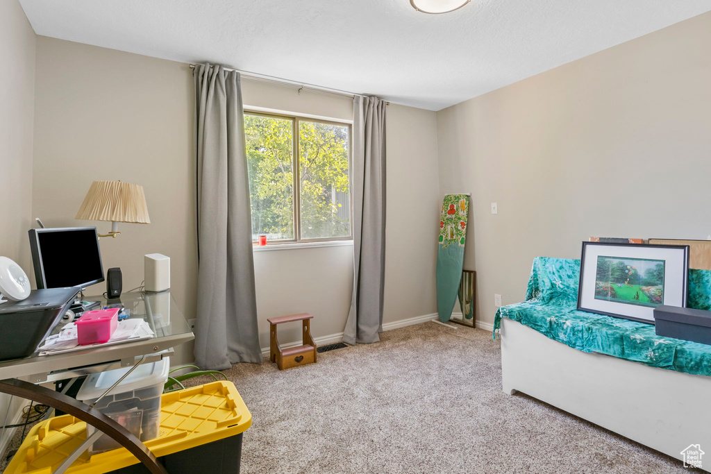Office space with carpet and baseboards