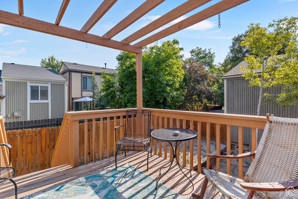 Wooden deck featuring a pergola