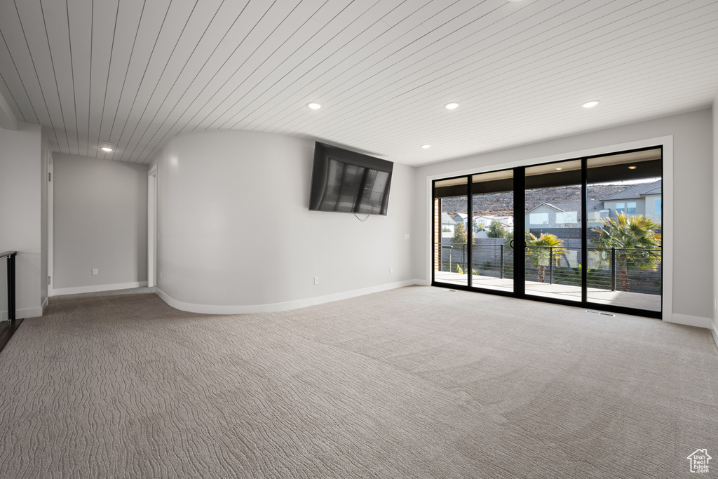 Spare room featuring recessed lighting and carpet floors