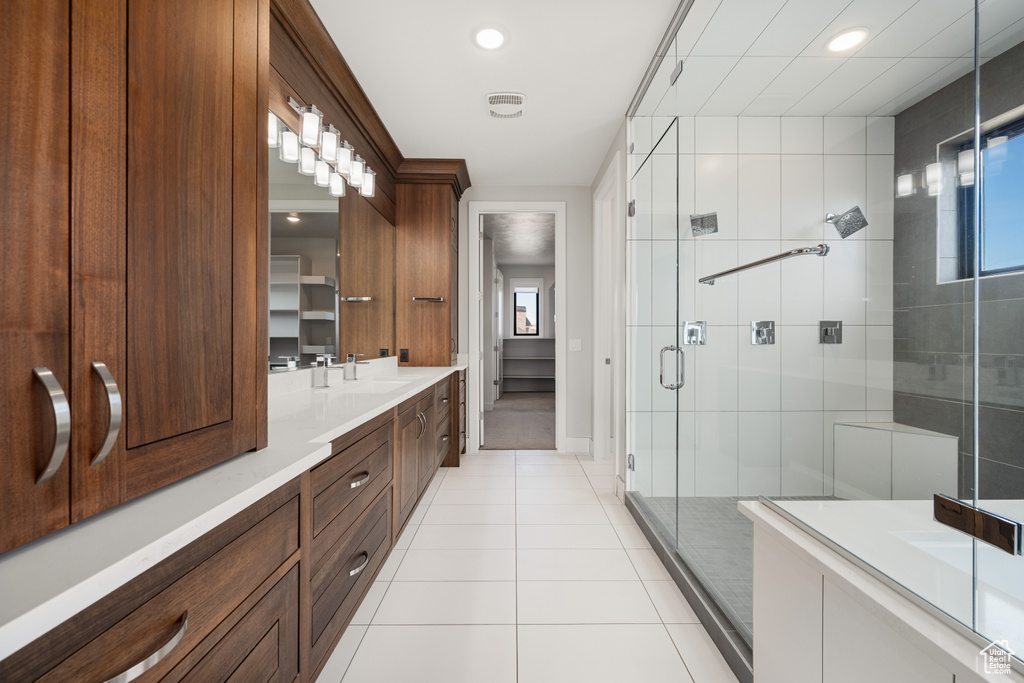 Full bathroom featuring vanity, tile patterned floors, a stall shower, and recessed lighting