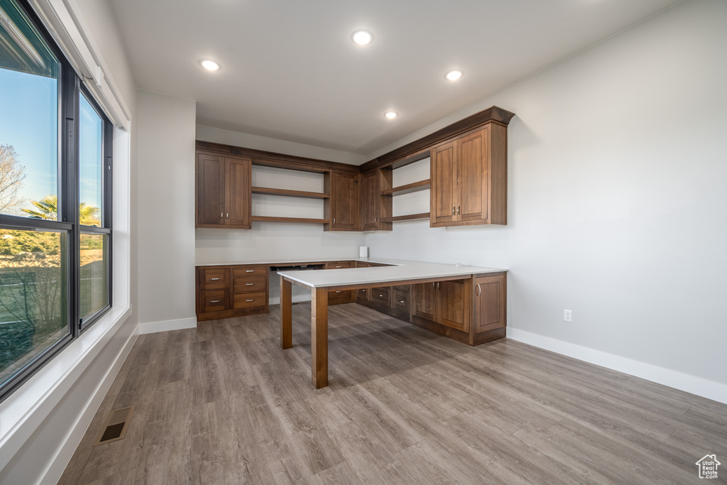 Unfurnished office featuring wood finished floors and recessed lighting