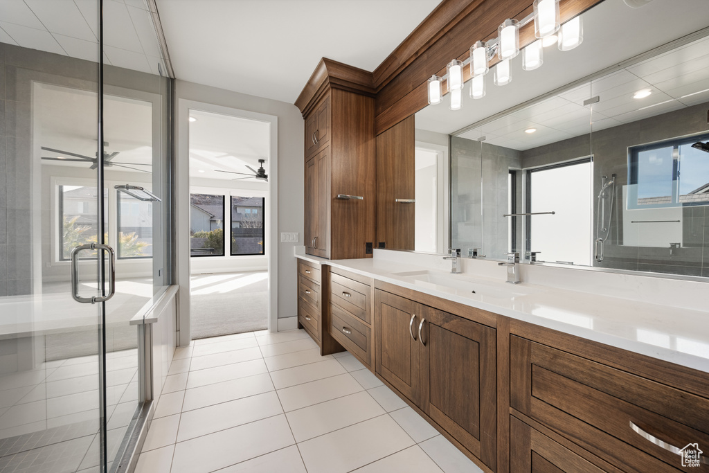 Full bath featuring vanity, a ceiling fan, a stall shower, tile patterned flooring, and recessed lighting