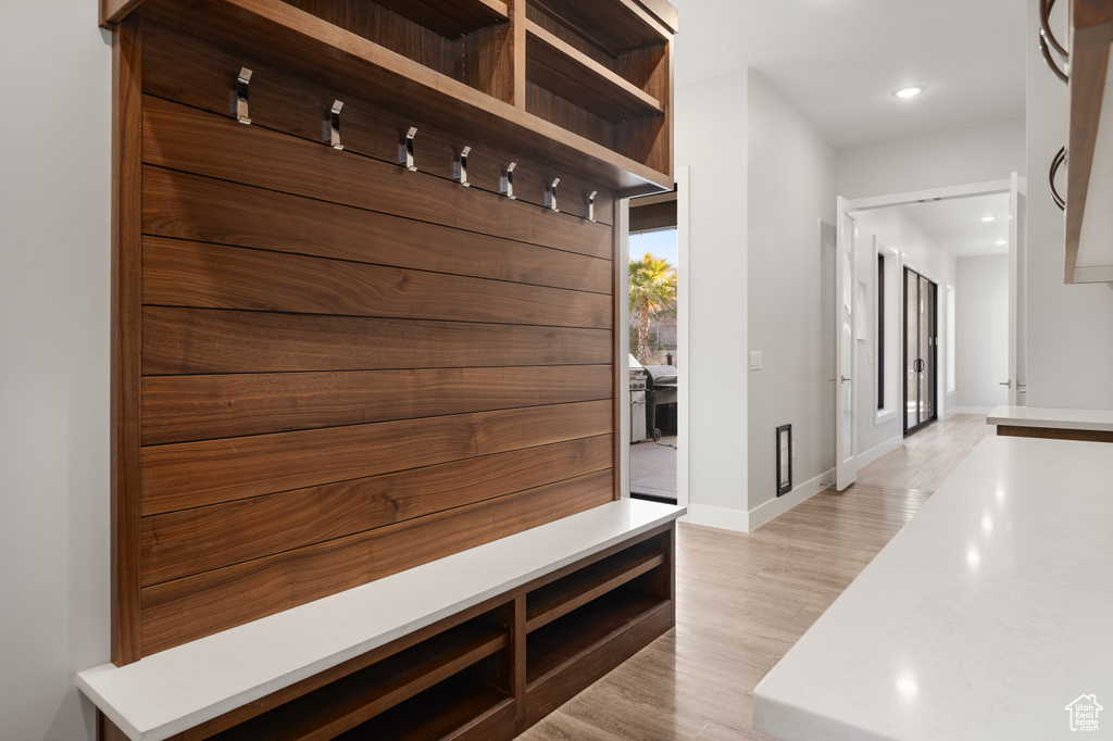 Mudroom featuring light wood-style flooring and recessed lighting