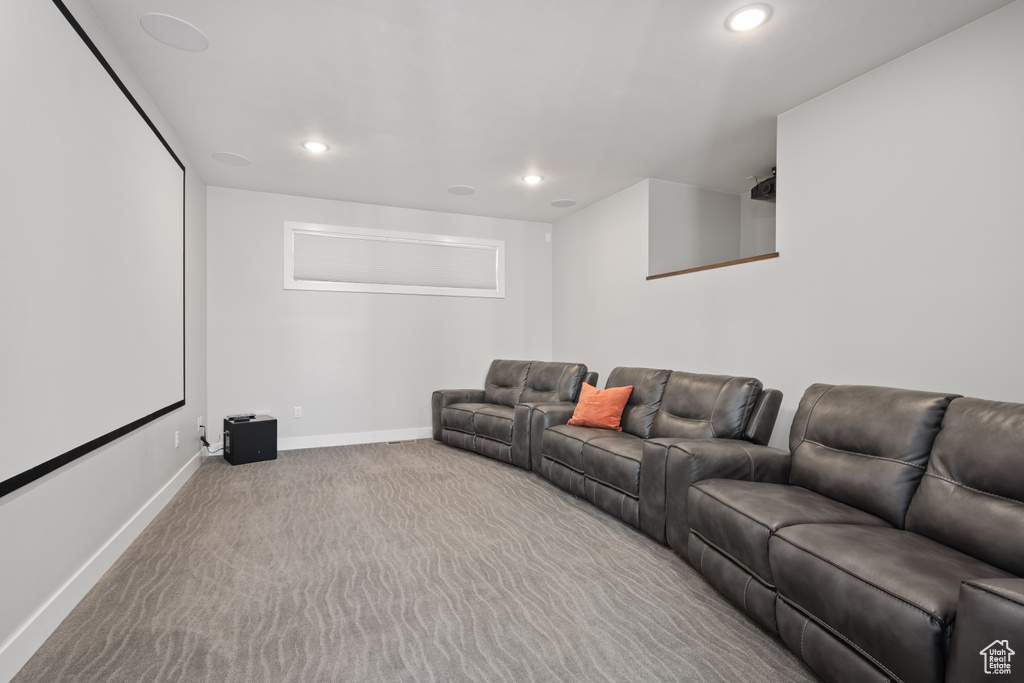 Home theater room with carpet floors and recessed lighting