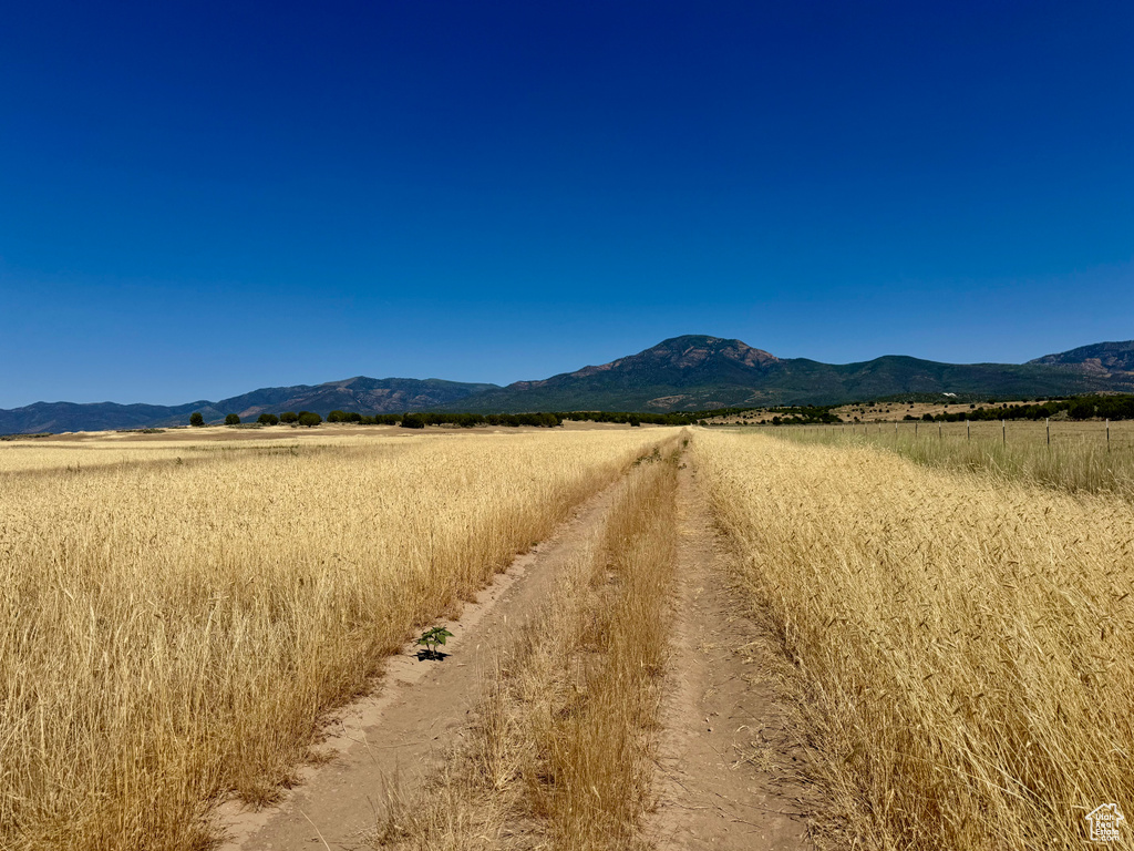 View of mountain backdrop with rural landscape