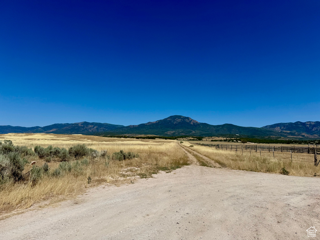 View of mountain backdrop featuring rural landscape