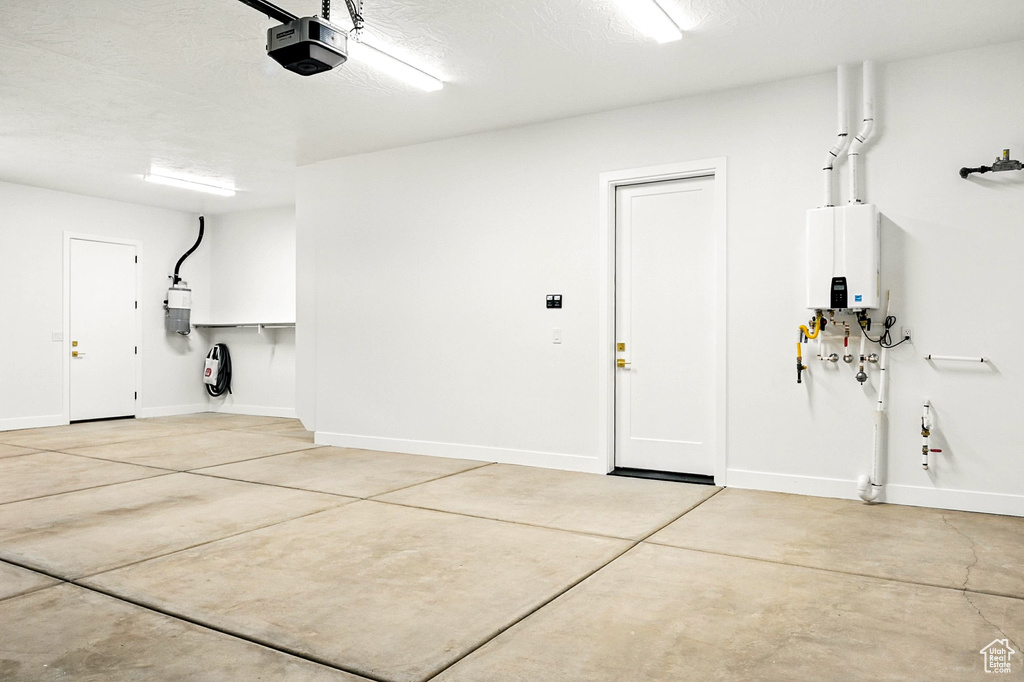Garage with a garage door opener and water heater