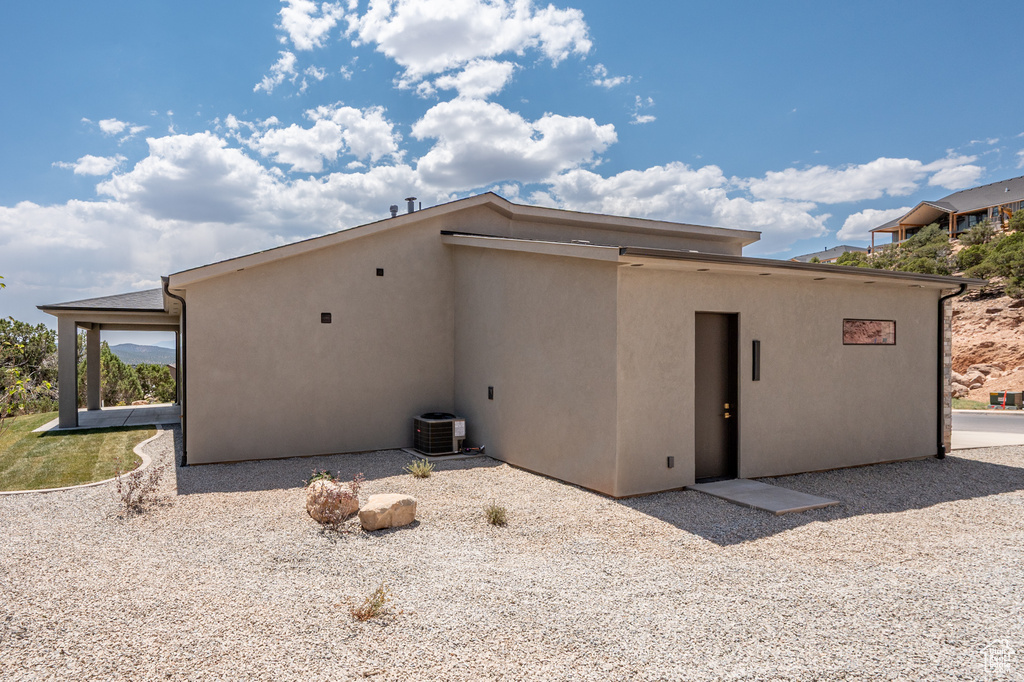 Rear view of house featuring stucco siding