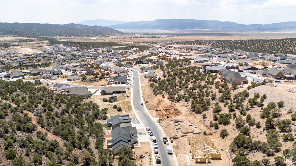 Aerial view of residential area featuring mountains