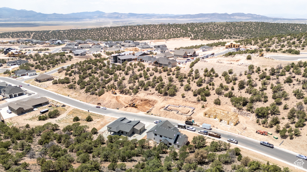 Aerial view of residential area featuring a mountainous background