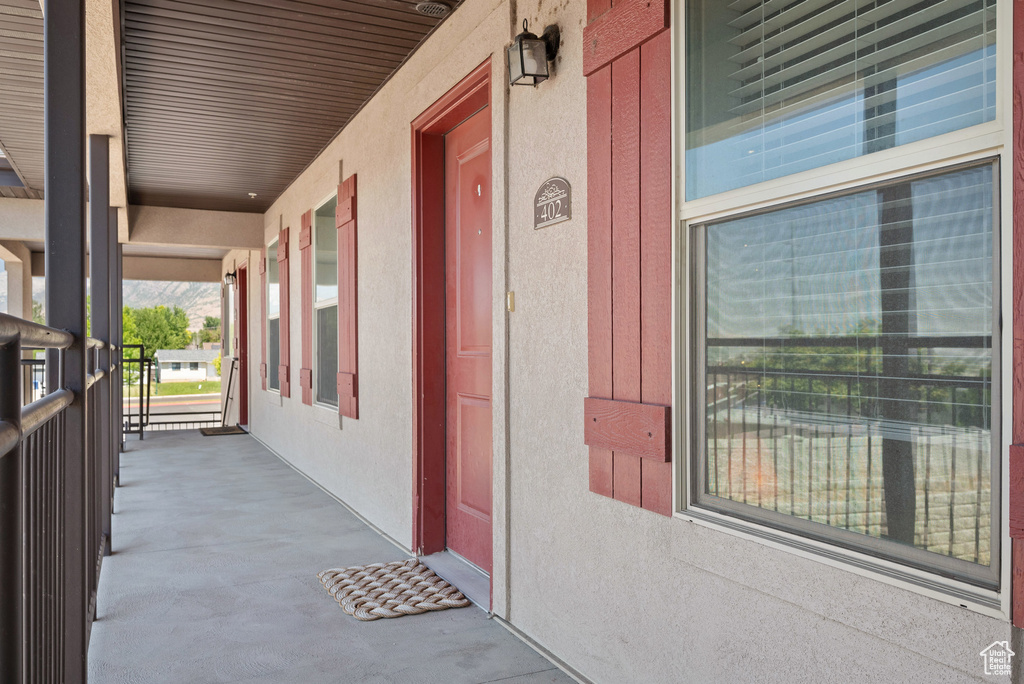 View of exterior entry with a porch