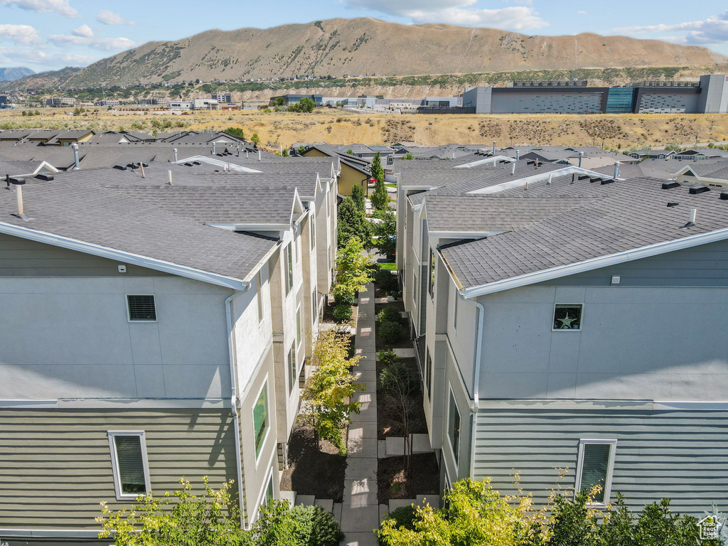 Aerial perspective of suburban area featuring a mountainous background