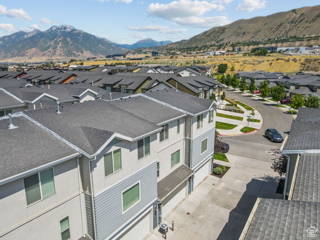 Aerial perspective of suburban area with a mountainous background