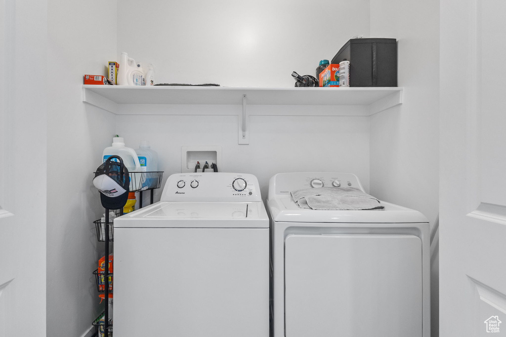 Laundry room featuring washing machine and clothes dryer