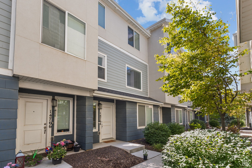 View of front of property featuring stucco siding