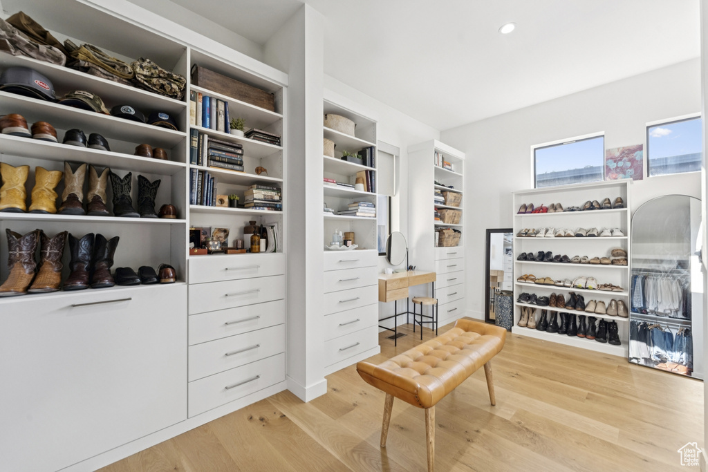 Walk in closet featuring wood finished floors