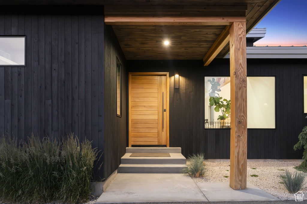 Entrance to property with a metal roof