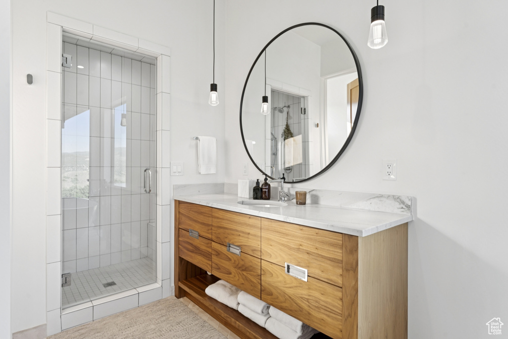 Bathroom with vanity and a shower stall