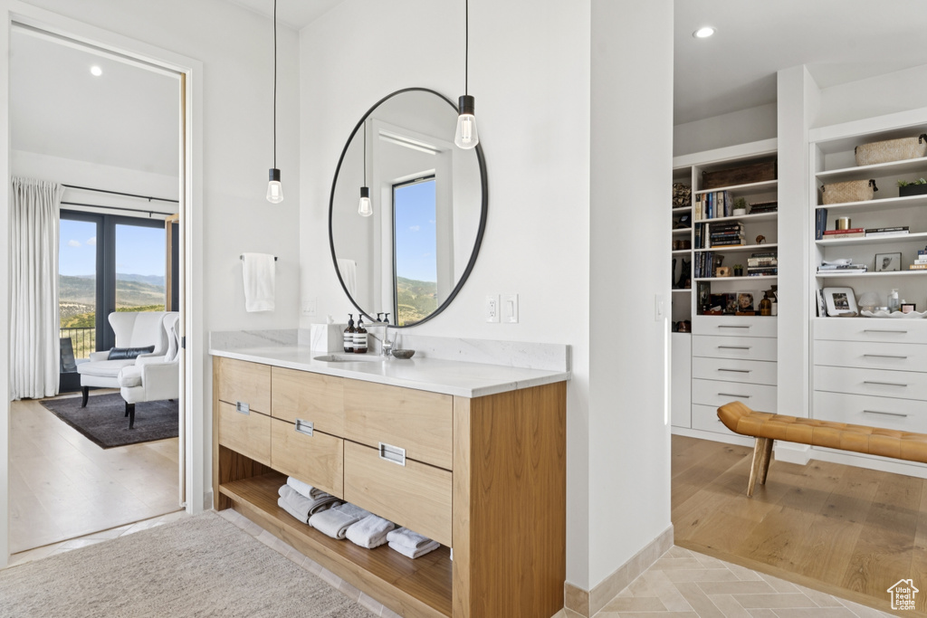 Bathroom with vanity and recessed lighting