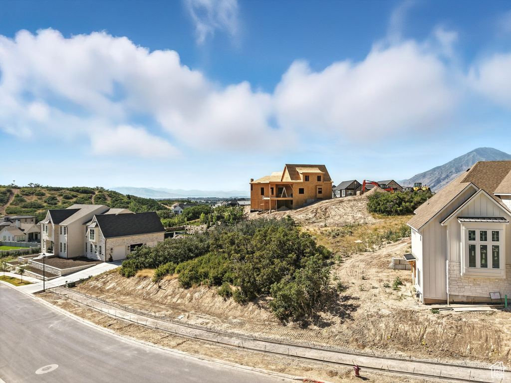 View of mountain background featuring nearby suburban area