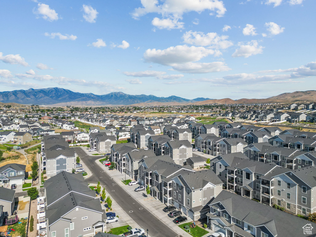 Aerial perspective of suburban area featuring a mountainous background