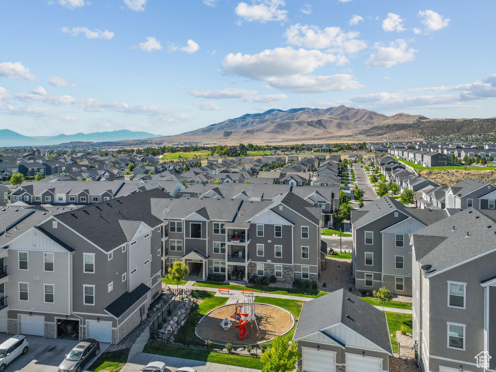 Aerial view of residential area featuring a mountain backdrop