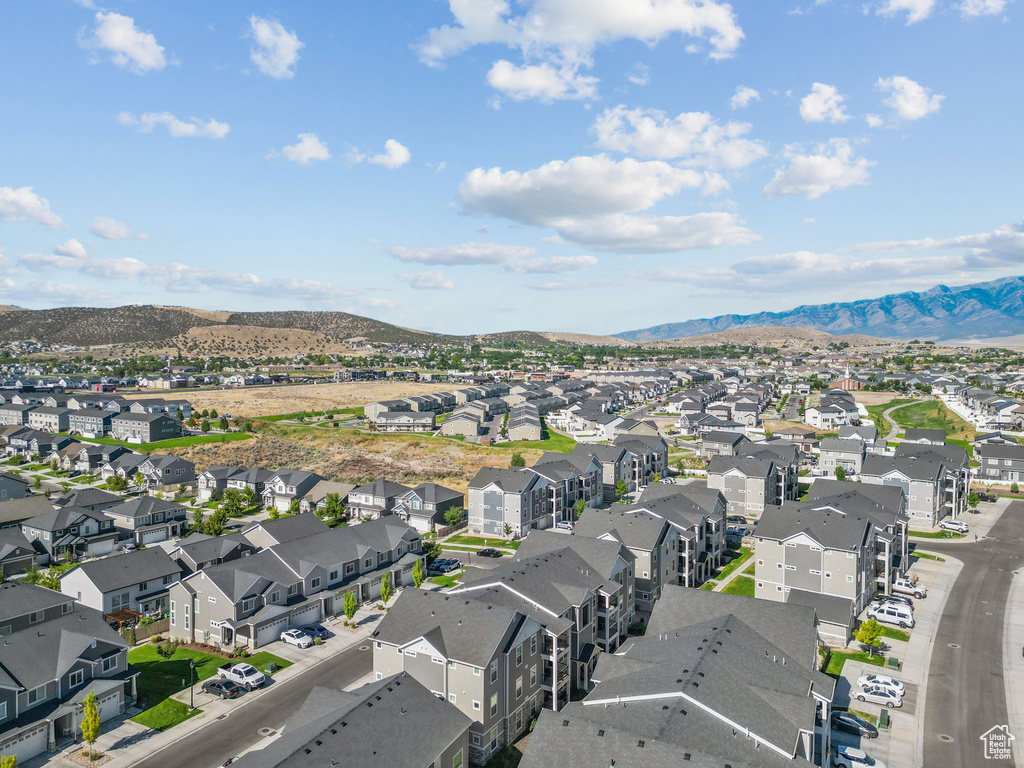 Aerial perspective of suburban area with a mountainous background
