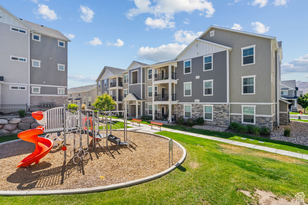 View of play area featuring a residential view and a lawn